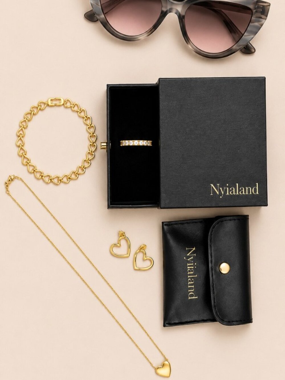 MK Grey Cat-Eye Sunnies & Nylialand Gold Heart Jewelry